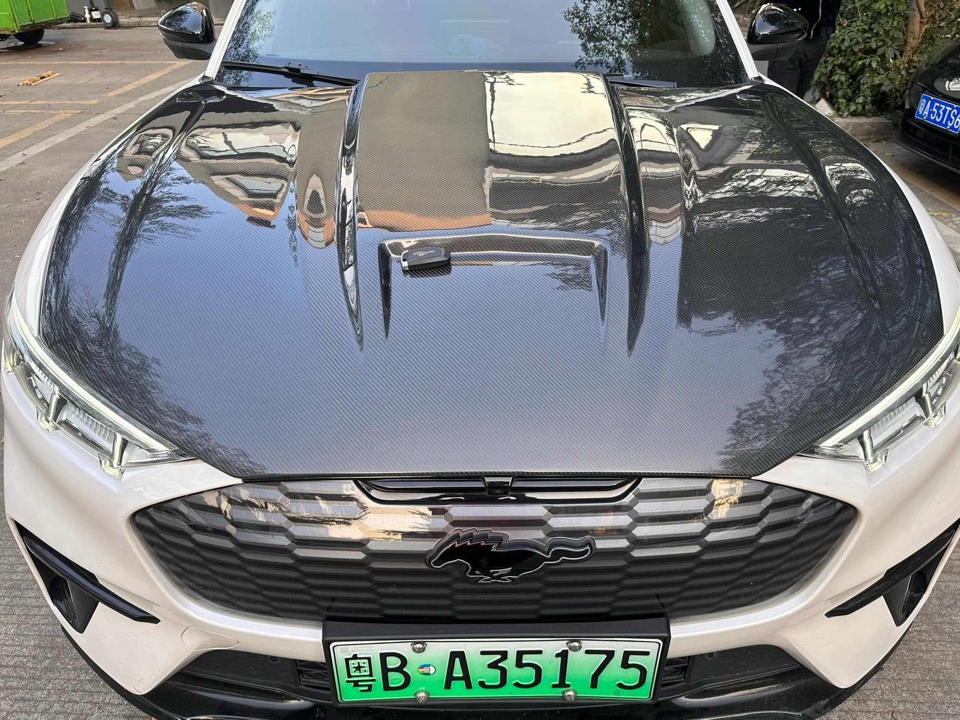 Ford Mustang Mach-E with GT550 style wet carbon fiber hood upgrade Fiber Hood for 2021-2025 models