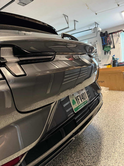 Close-up of Mustang Mach-E rear with Spoiler V2 installed in a garage