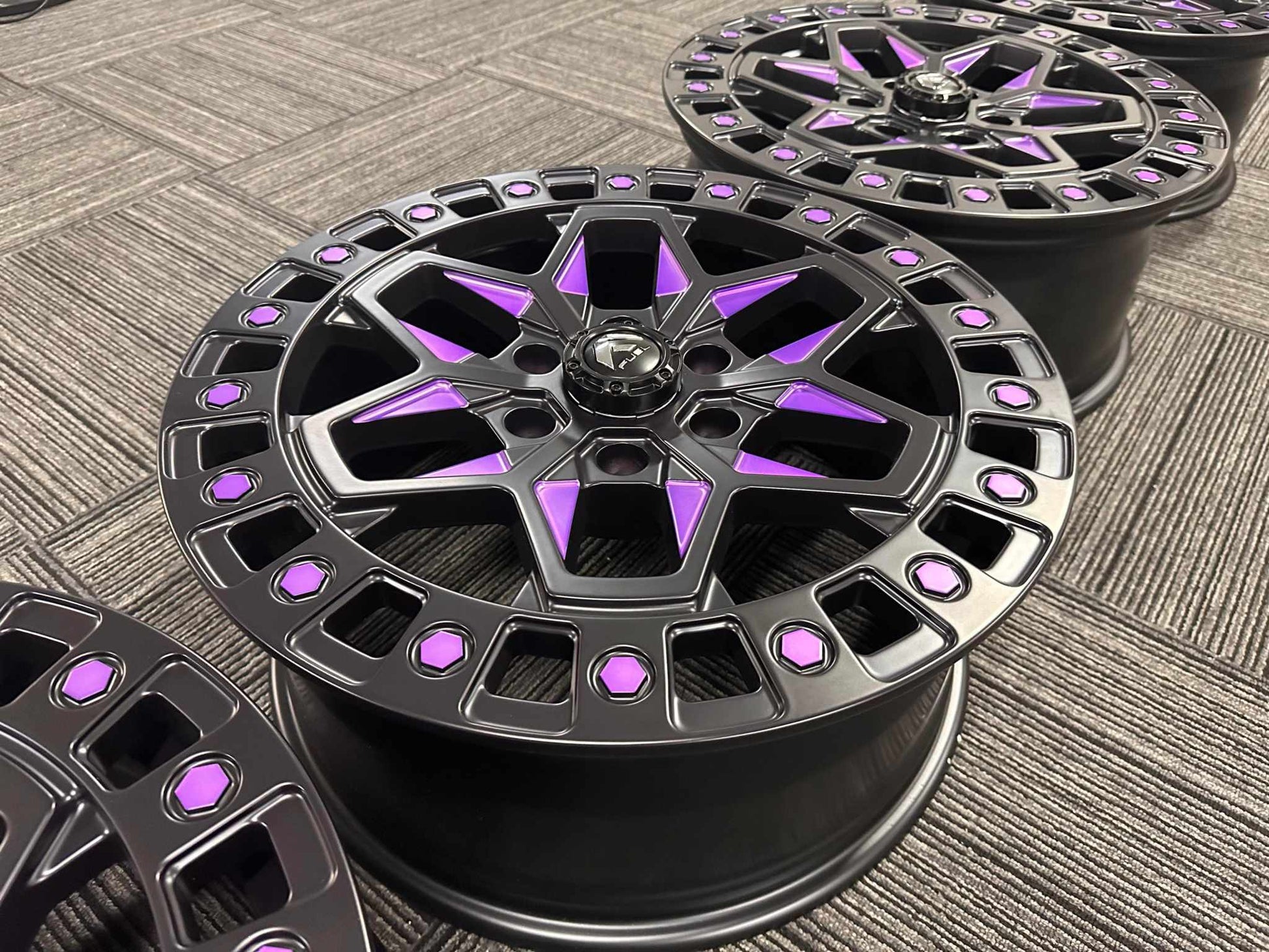 Custom forged aluminum wheels for Mustang Mach-E with black and purple accents, lightweight and durable design.