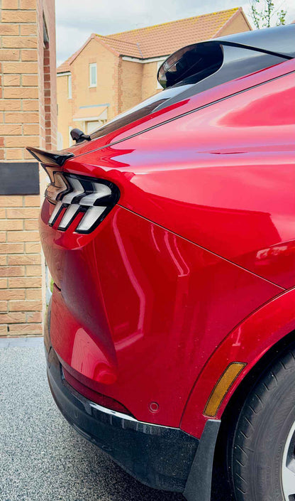 Spoiler V2 for Mustang Mach-E rear view in carbon black on red 2021-2025 model