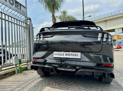 Rear diffuser installed on black Mustang Mach-E GT rear view showcasing aerodynamic enhancements