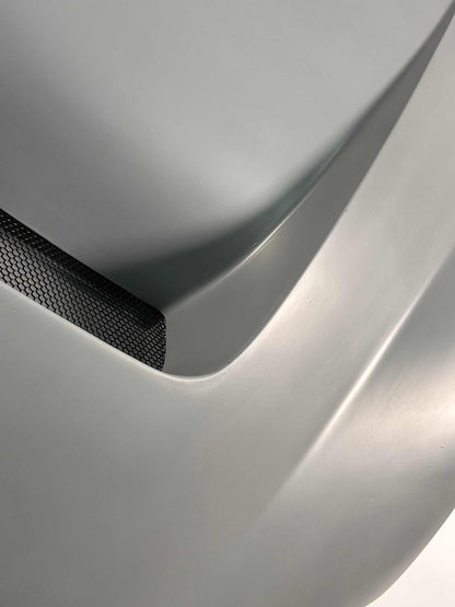 Shelby Style Fiber Hood close-up showing smooth aerodynamic design and vent details.