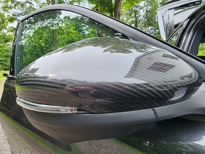 Carbon fiber mirror caps for Mustang Mach-E side mirror replacement, compatible with 2021-2025 models, sleek and durable design.