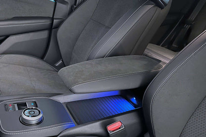 custom-made armrest in car interior with premium Alcantara and leather upholstery