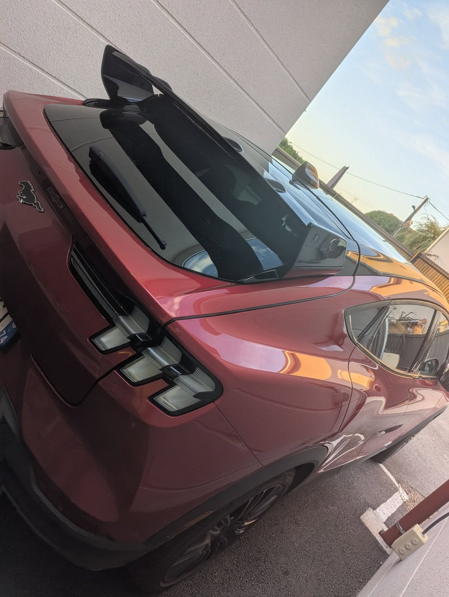 Rally Wing Spoiler installed on red Ford Mustang Mach-E rear with sleek aerodynamic design and glossy finish