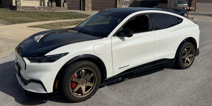 Ford Mustang Mach-E with black Shelby Style Fiber Hood and bronze alloy wheels parked on driveway