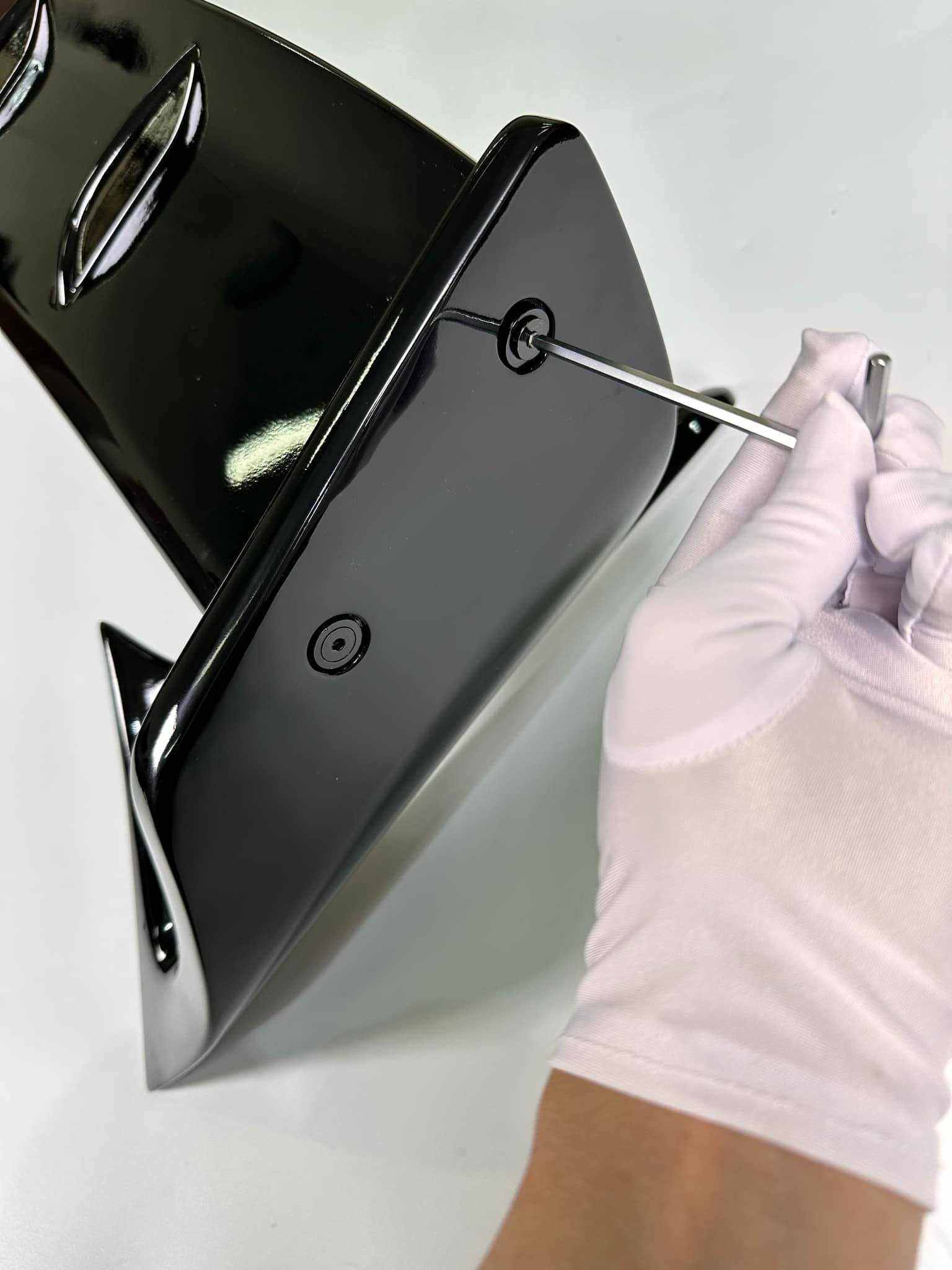 Close-up of black Rally LED Wing brake light being installed with a screwdriver, designed for Ford Mustang Mach-E 2021-2025.