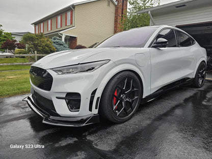 Front Lip Splitter wet carbon fiber installed on white Mustang Mach-E GT 2021-2025 with sporty black wheels.