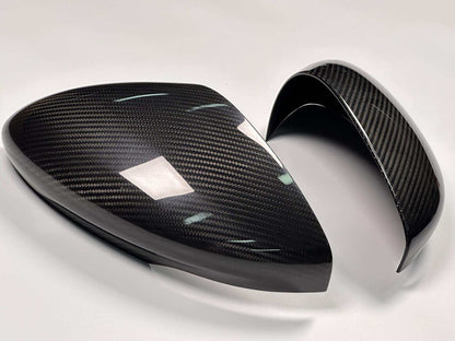 Dry carbon fiber mirror caps for Mustang Mach-E 2021-2025 in carbon black and forged carbon options.
