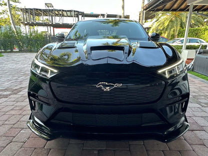Front view of black Mustang Mach-E with Shelby GT550 style carbon fiber hood and vents