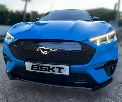Blue Ford Mustang Mach-E GT with illuminated GT pony emblem on front grille