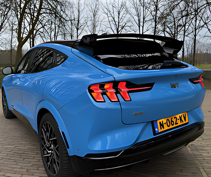 Blue Ford Mustang Mach-E with black carbon fiber Rally Wing Spoiler on rear trunk for improved aerodynamics and sporty look