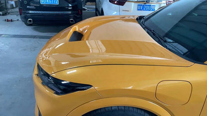 Yellow Ford Mustang Mach-E with installed Shelby Style Fiber Hood featuring carbon fiber vent design