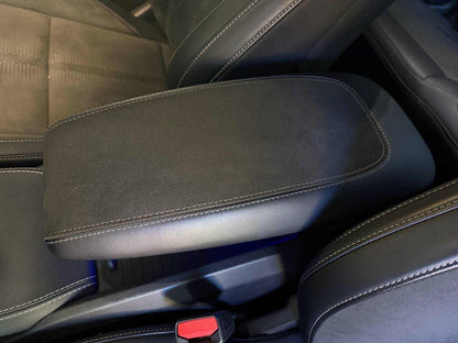 Custom-made black leather and Alcantara armrest with white stitching for car interior upgrade
