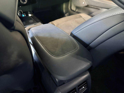 custom-made armrest in black Alcantara and leather with detailed stitching for car interior upgrade