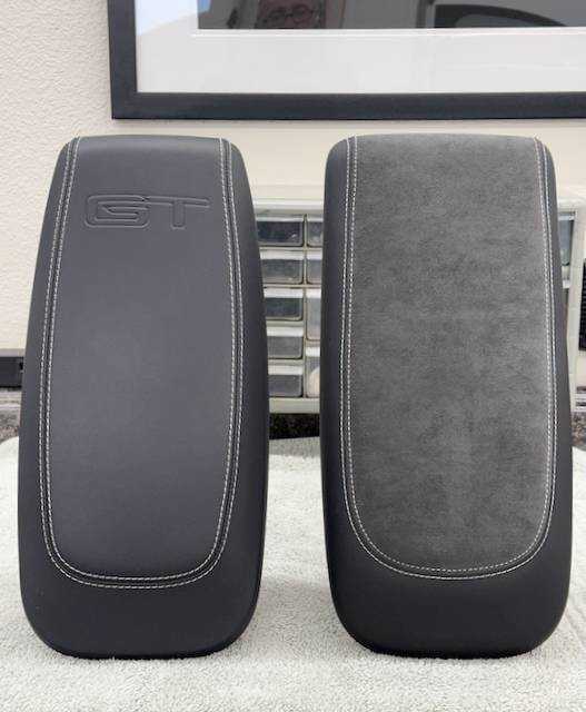 Custom-made armrest pair with premium leather and Alcantara, white stitching, and embossed GT logo for ultimate comfort and style upgrade