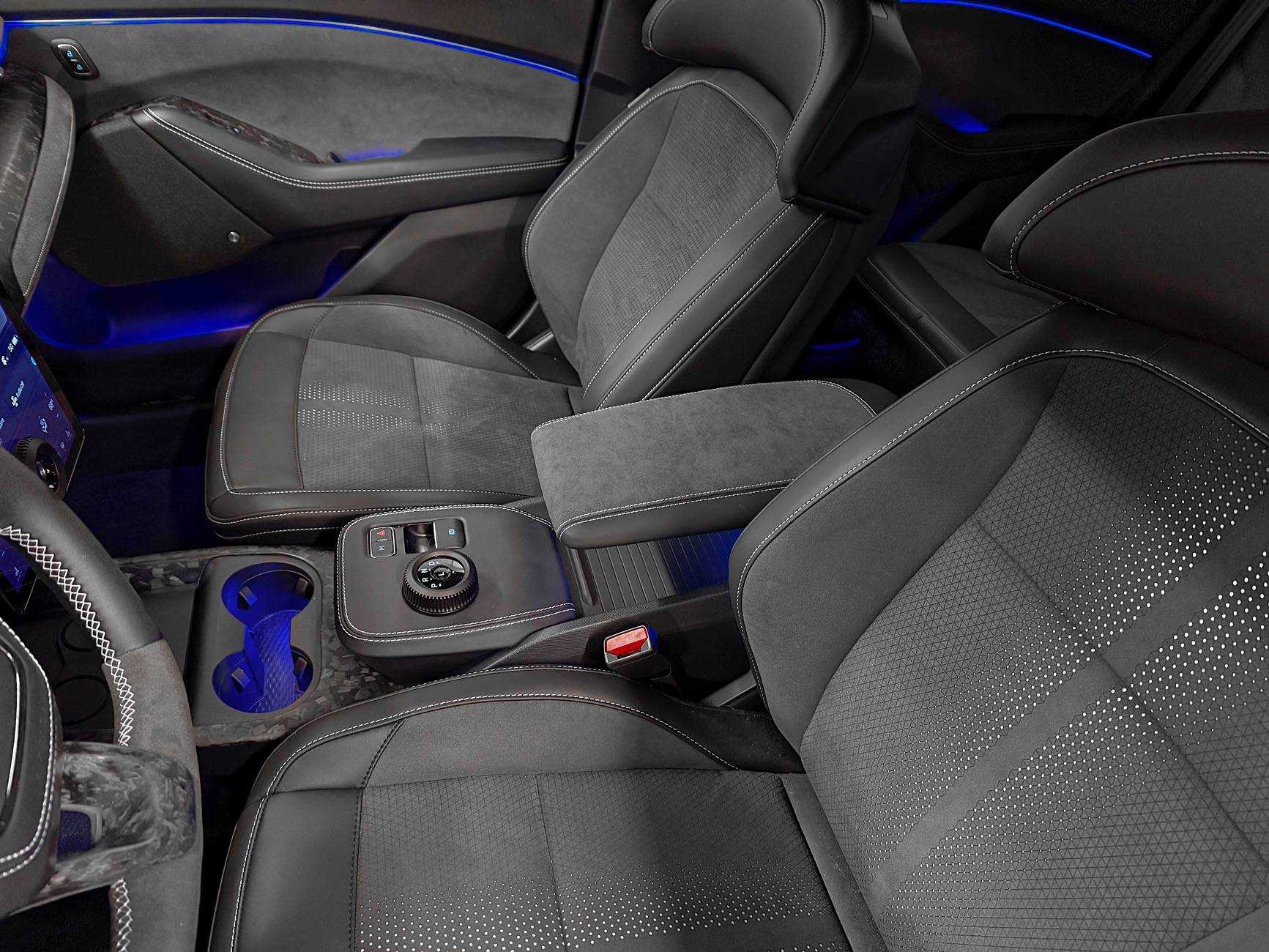 Custom-made armrest in black Alcantara and leather with red stitching for enhanced comfort and style in car interior