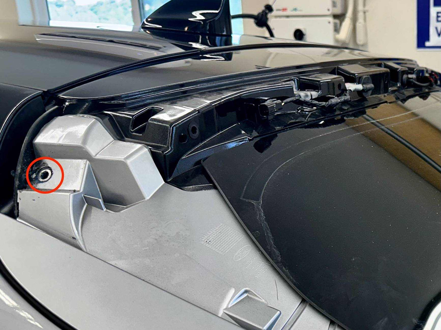 Close-up of retractable spoiler mechanism on Mustang Mach-E tailgate