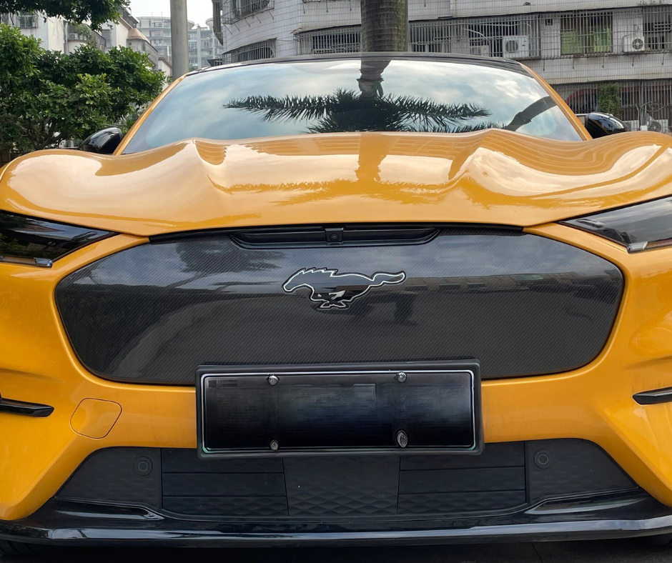 Yellow Mustang Mach-E GT with GT Grill V1 carbon fiber front grille installed