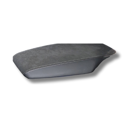 custom-made armrest in Alcantara and leather with stitched edges for enhanced comfort and style