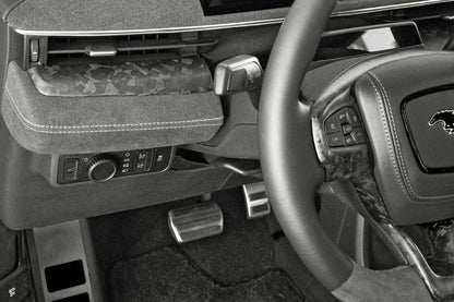Dry carbon fiber dash panel installed in Ford Mustang Mach-E interior with forged carbon finish and steering wheel details