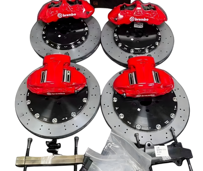 Front and rear drilled carbon ceramic disc rotors with red Brembo calipers and ceramic brake pads for 2021-2025 Ford Mustang Mach-E GT/GTPE