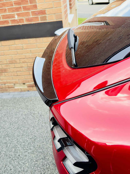 Carbon fiber Spoiler V2 for Mustang Mach-E 2021-2025 in black installed on red car rear.