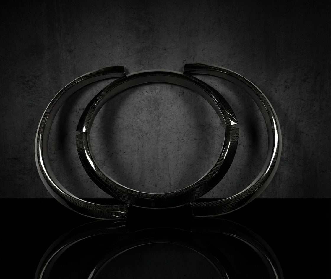 Wider fender flares in carbon, forged, and primer fiberglass for all models, enhancing fit with extra 20mm rear and 16mm front clearance for wider tires.