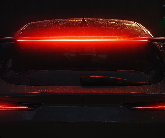 Rally LED Wing brake light installed on rear of Ford Mustang Mach-E glowing red at night