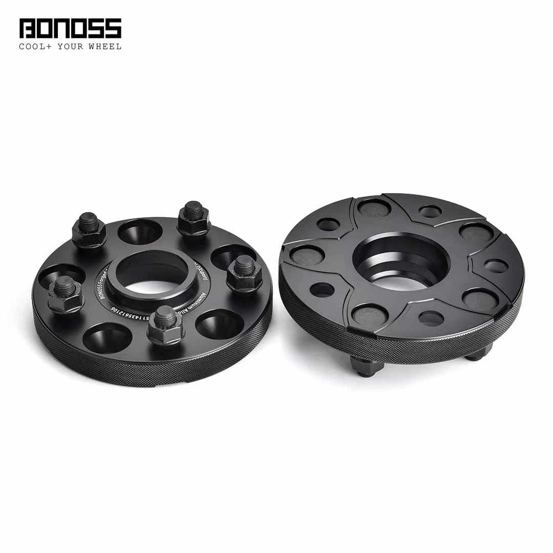 Pair of black forged aluminum wheel spacers with bolts for vehicle performance and appearance enhancement