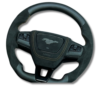 Custom made steering wheel for Mustang Mach-E with Alcantara grip, carbon fiber accents, and multifunction buttons