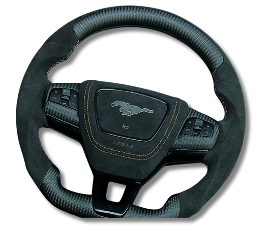 Custom made steering wheel for Mustang Mach-E with Alcantara grip, carbon fiber accents, and multifunction buttons