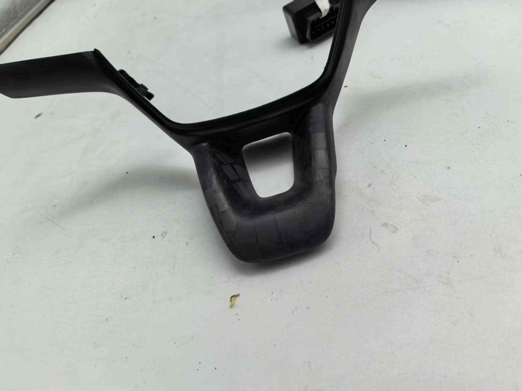 Mustang Mach-E premium steering wheel trim part in carbon finish isolated on white background